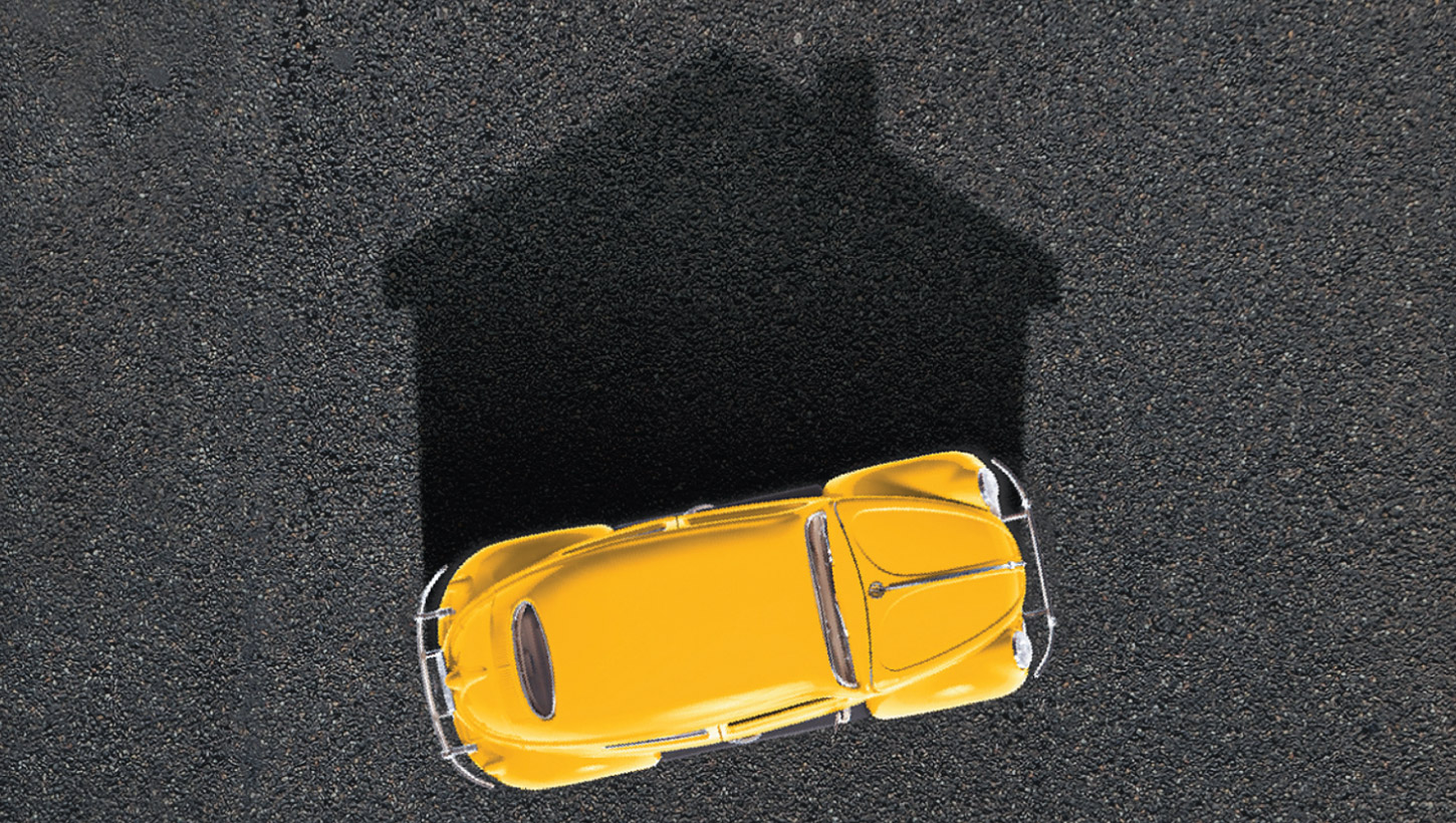 yellow car with shawdow of house