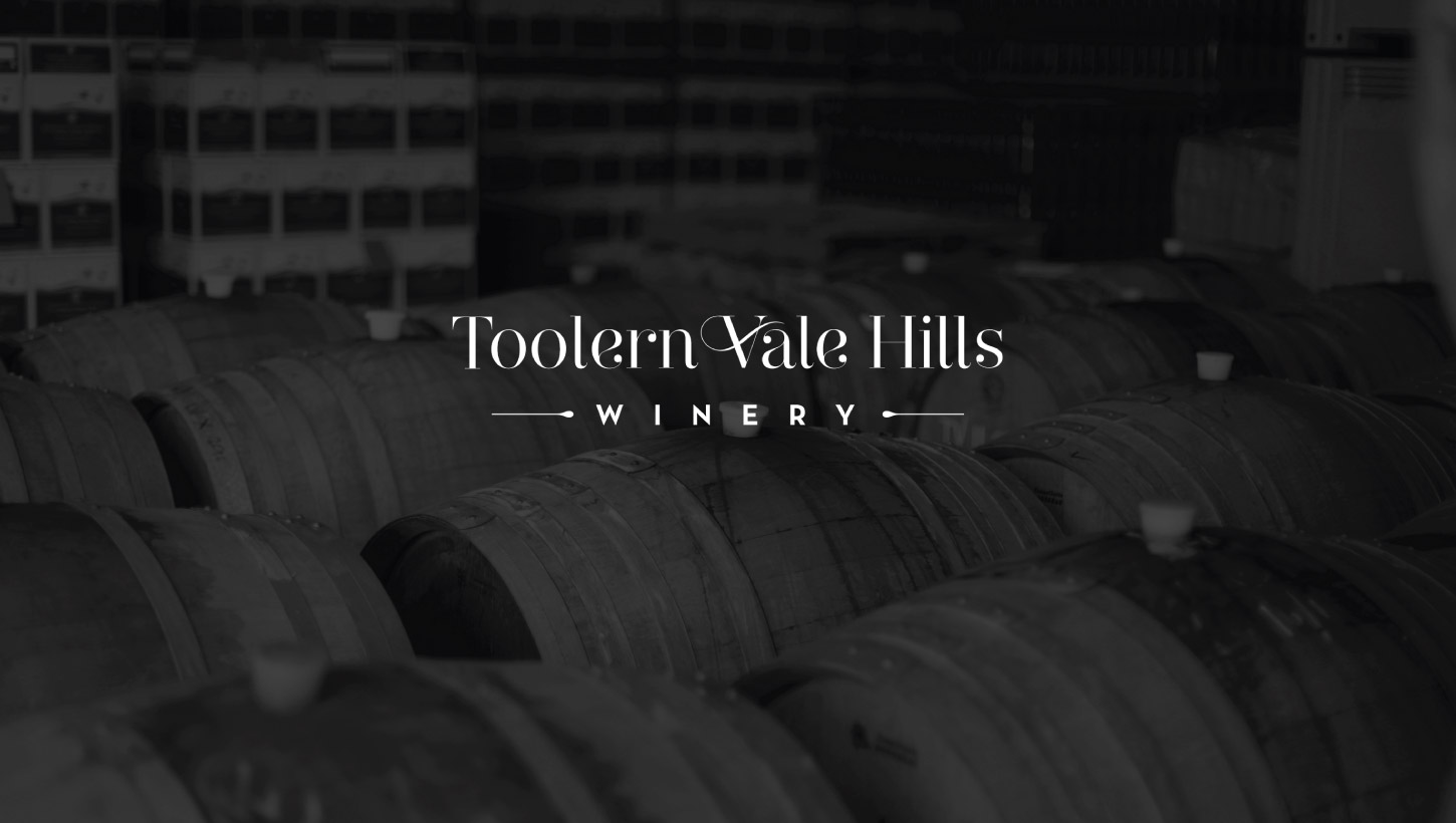 toolern vale logo photography with wine barrels